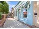 Charming storefront with floral decor and outdoor seating, creating an inviting ambiance at 823 Mackay Crk, Woodstock, GA 30188
