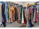 Walk-in closet with rows of clothing hung on rods and lots of storage space at 823 Mackay Crk, Woodstock, GA 30188