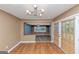 Comfortable dining area with modern light fixture and sliding doors to the outside at 916 Forest Pointe, Jonesboro, GA 30238
