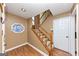 Warm entryway with wood flooring, stained glass feature, and a staircase leading upstairs at 916 Forest Pointe, Jonesboro, GA 30238