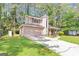 Charming two-story home with a unique turret and an attached two-car garage nestled among mature trees at 916 Forest Pointe, Jonesboro, GA 30238