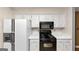 Kitchen featuring stainless steel appliances and white cabinetry at 916 Forest Pointe, Jonesboro, GA 30238