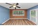 Inviting living room featuring a ceiling fan and direct access to an outdoor area at 916 Forest Pointe, Jonesboro, GA 30238