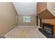 Cozy living room featuring a fireplace, ample natural light, and neutral carpet at 916 Forest Pointe, Jonesboro, GA 30238