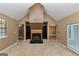 Bright living room with built-in bookshelves, fireplace and access to the outdoor patio at 916 Forest Pointe, Jonesboro, GA 30238