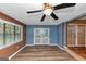 Bright living room with a ceiling fan, access to outdoor area, and neutral flooring at 916 Forest Pointe, Jonesboro, GA 30238