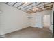 Unfinished basement room with visible ceiling insulation, showing the potential for a functional space at 115 Blue Grass Way, Oxford, GA 30054