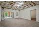 Unfinished basement with large carpeted area, ready for customization, perfect for a recreation room at 115 Blue Grass Way, Oxford, GA 30054