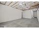 Unfinished basement room with carpet, a window, and open ceiling at 115 Blue Grass Way, Oxford, GA 30054