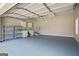Spacious garage with ample storage and convenient access to the home's interior at 115 Blue Grass Way, Oxford, GA 30054