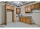 Unfinished kitchen space with light wood cabinets, granite countertops, and white appliances at 115 Blue Grass Way, Oxford, GA 30054