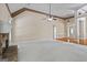 Spacious living room featuring hardwood floors, a fireplace, and elegant architectural details at 115 Blue Grass Way, Oxford, GA 30054