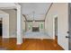 Bright, open living room featuring hardwood floors, stone fireplace and ample natural light at 115 Blue Grass Way, Oxford, GA 30054