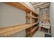Room with built-in wooden shelves at 115 Blue Grass Way, Oxford, GA 30054