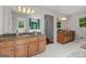 Bathroom featuring double vanities with granite countertops and ample natural light at 401 Riverwalk, Mcdonough, GA 30252