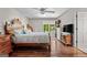 Bedroom featuring a classic wood bed frame, bookshelf, and view of the backyard at 401 Riverwalk, Mcdonough, GA 30252