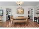 Bright dining room features hardwood floors and a chandelier at 401 Riverwalk, Mcdonough, GA 30252