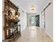 Elegant foyer with tile flooring, a decorative mirror, and a welcoming entrance at 401 Riverwalk, Mcdonough, GA 30252