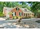 Lovely brick home with manicured lawn and blooming flowerbeds at 401 Riverwalk, Mcdonough, GA 30252