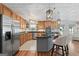 Updated kitchen features custom wood cabinets, stainless appliances, and a granite island at 401 Riverwalk, Mcdonough, GA 30252