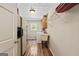 Functional laundry room features wood-look floors, sink, and storage shelves at 401 Riverwalk, Mcdonough, GA 30252