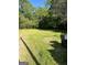Grassy backyard, providing ample space for outdoor activities and relaxation at 908 Emory St, Oxford, GA 30054