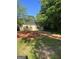 Charming one-story house featuring a brick driveway and quaint windows at 908 Emory St, Oxford, GA 30054