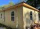 Exterior corner view of a house featuring new siding and windows, highlighting recent renovations at 908 Emory St, Oxford, GA 30054
