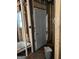 Interior featuring exposed studs, new door installation and a window at 908 Emory St, Oxford, GA 30054