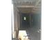 Exposed framing shows the house's interior under renovation, with natural light streaming in at 908 Emory St, Oxford, GA 30054