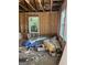 Unfinished room with exposed studs, rough insulation, and a window at 908 Emory St, Oxford, GA 30054