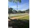 Charming neighborhood street with sidewalks and lush green lawns under a clear blue sky at 908 Emory St, Oxford, GA 30054