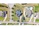 Aerial view of a meticulously landscaped property with a pool, showcasing an elegant home and manicured grounds at 1516 Winward Dr, Locust Grove, GA 30248