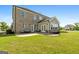The backyard includes a patio area and an enclosed sunroom at 1516 Winward Dr, Locust Grove, GA 30248