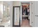 Bathroom with shower, closet, and mirror showing the bathroom at 1516 Winward Dr, Locust Grove, GA 30248