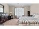 Spacious bedroom with neutral walls, carpet, and lots of natural light at 1516 Winward Dr, Locust Grove, GA 30248