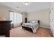 Comfortable bedroom featuring a plush bed, neutral walls, and lots of natural light at 1516 Winward Dr, Locust Grove, GA 30248