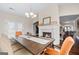 Dining room featuring a fireplace, hardwood floors, neutral paint and an open floor plan at 1516 Winward Dr, Locust Grove, GA 30248