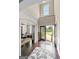 Spacious foyer with hardwood floors and an open layout, leading into a bright living area at 1516 Winward Dr, Locust Grove, GA 30248