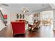 Cozy living room featuring hardwood floors, neutral paint, a fireplace, and an open floor plan at 1516 Winward Dr, Locust Grove, GA 30248