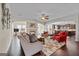 Spacious living room featuring a fireplace, hardwood floors, neutral paint, ceiling fan and an open floor plan at 1516 Winward Dr, Locust Grove, GA 30248