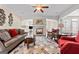 Bright living room boasting a fireplace, hardwood floors, neutral paint and lots of natural light at 1516 Winward Dr, Locust Grove, GA 30248