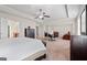Spacious main bedroom offers a connected sitting area, en suite bathroom, and neutral walls at 1516 Winward Dr, Locust Grove, GA 30248