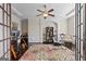 Elegant office space with hardwood floors and custom shelving, perfect for a home office or study at 1516 Winward Dr, Locust Grove, GA 30248