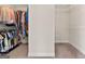 Dual walk-in closets each feature carpet and metal shelving for seamless storage at 1516 Winward Dr, Locust Grove, GA 30248
