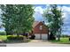 Charming brick home with a two-car garage, mature trees, and a well-maintained lawn at 690 Gateway Ct, Stone Mountain, GA 30087