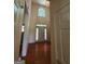 Inviting two story foyer with hardwood floors, a transom window, and a clear view of the front door at 690 Gateway Ct, Stone Mountain, GA 30087