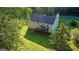 Charming home with inviting deck, lush lawn, and mature trees offers outdoor living and natural beauty at 2006 Carrollton Hwy, Temple, GA 30179