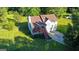 Aerial view of charming home with a welcoming front porch, mature trees, and lush green lawn at 2006 Carrollton Hwy, Temple, GA 30179