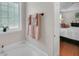 Bright bathtub area with light and privacy window, next to the main bedroom at 2006 Carrollton Hwy, Temple, GA 30179